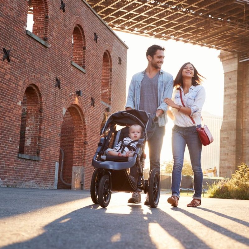 Family consisting of a man a woman and a baby